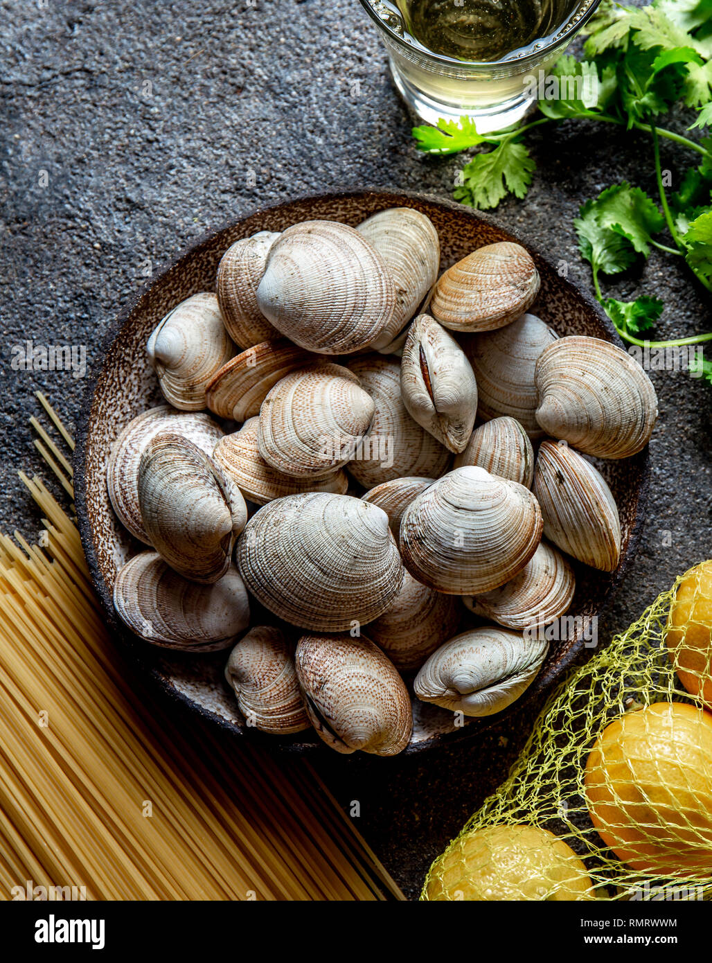 Ingredients for preparation spaghetti with clams raw fresh clams