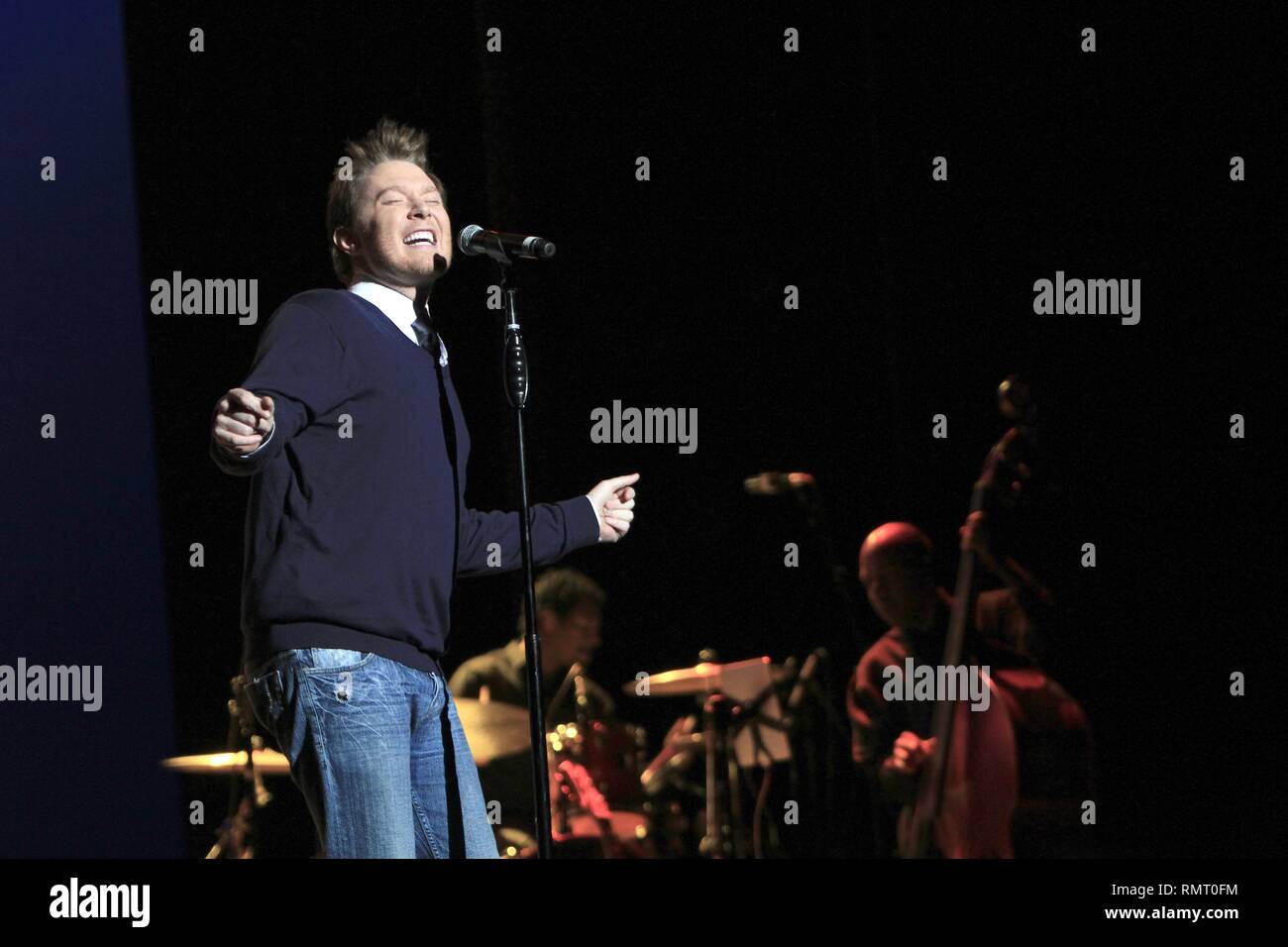 SInger Clay Aiken is shown performing on stage during a "live" concert