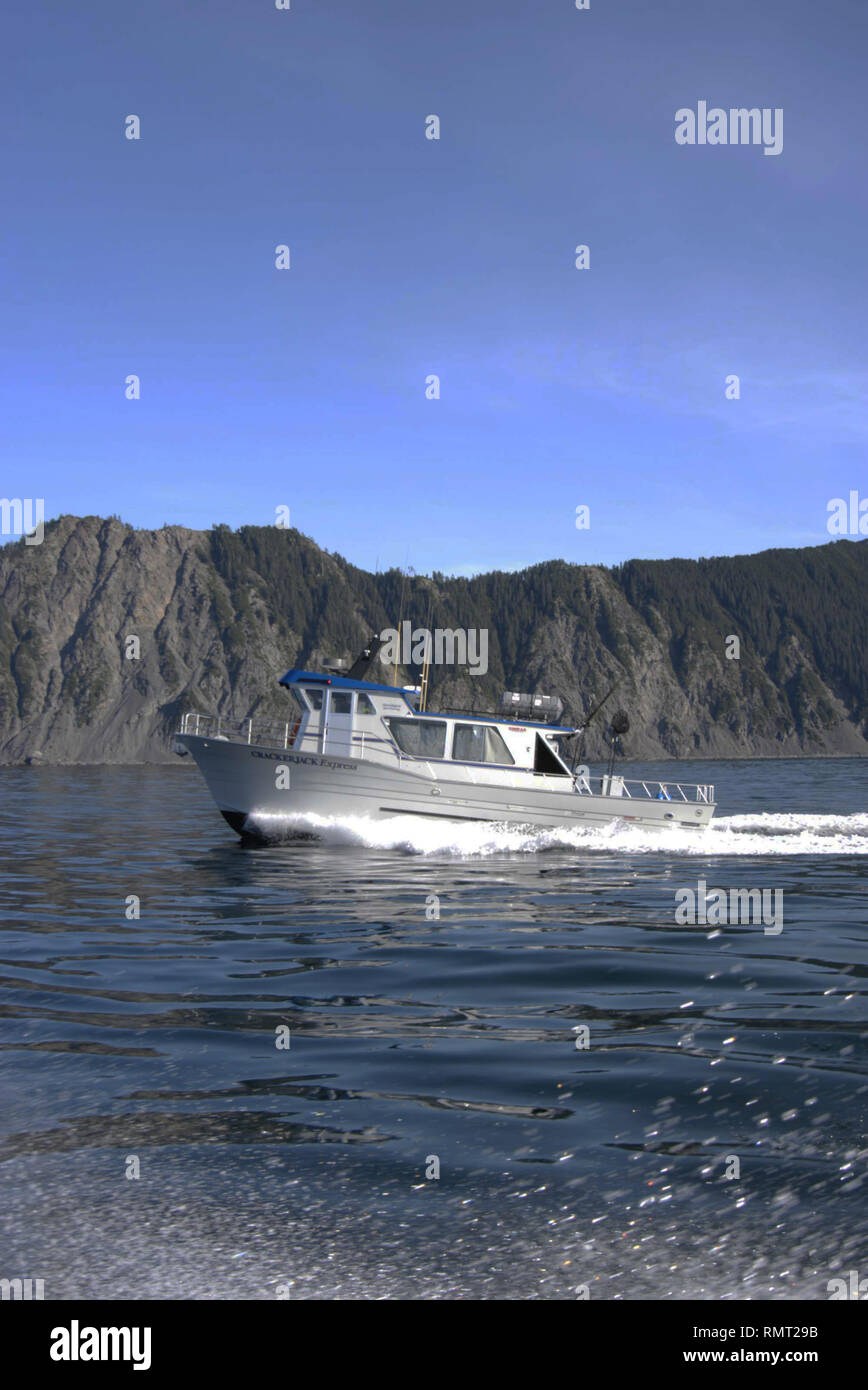 Charter Boat Crackerjack Express running on the fishing grounds near Seward,Alaska Stock Photo