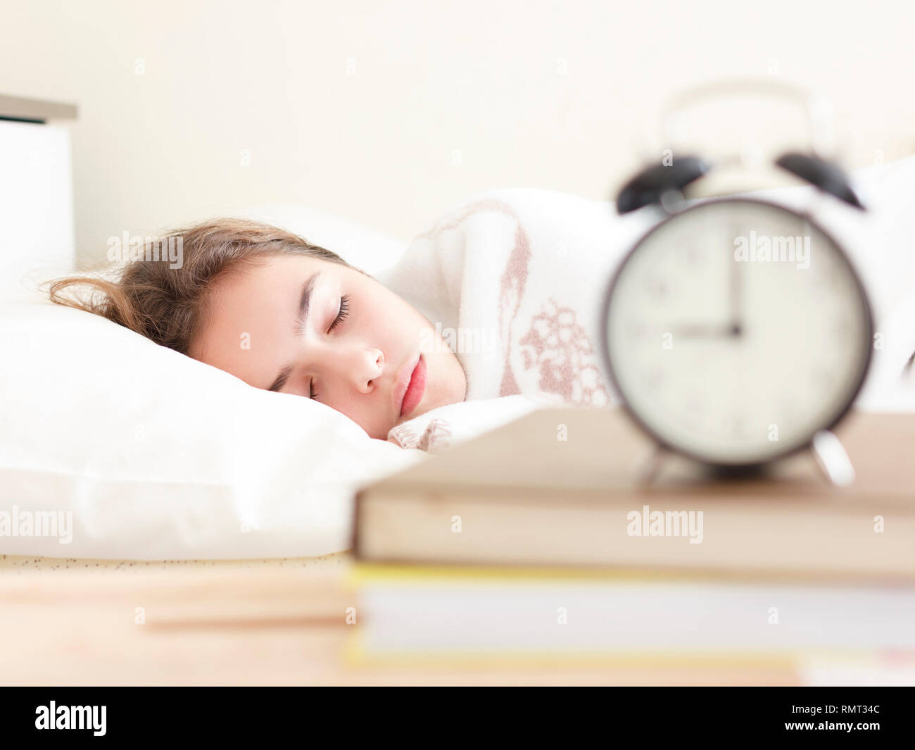 Teenager sleeping bed alarm clock hires stock photography and images