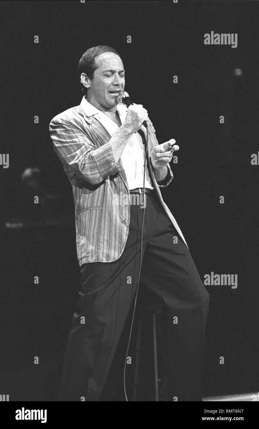 Singer Paul Anka is shown performing on stage during a 'live' concert appearance. Stock Photo