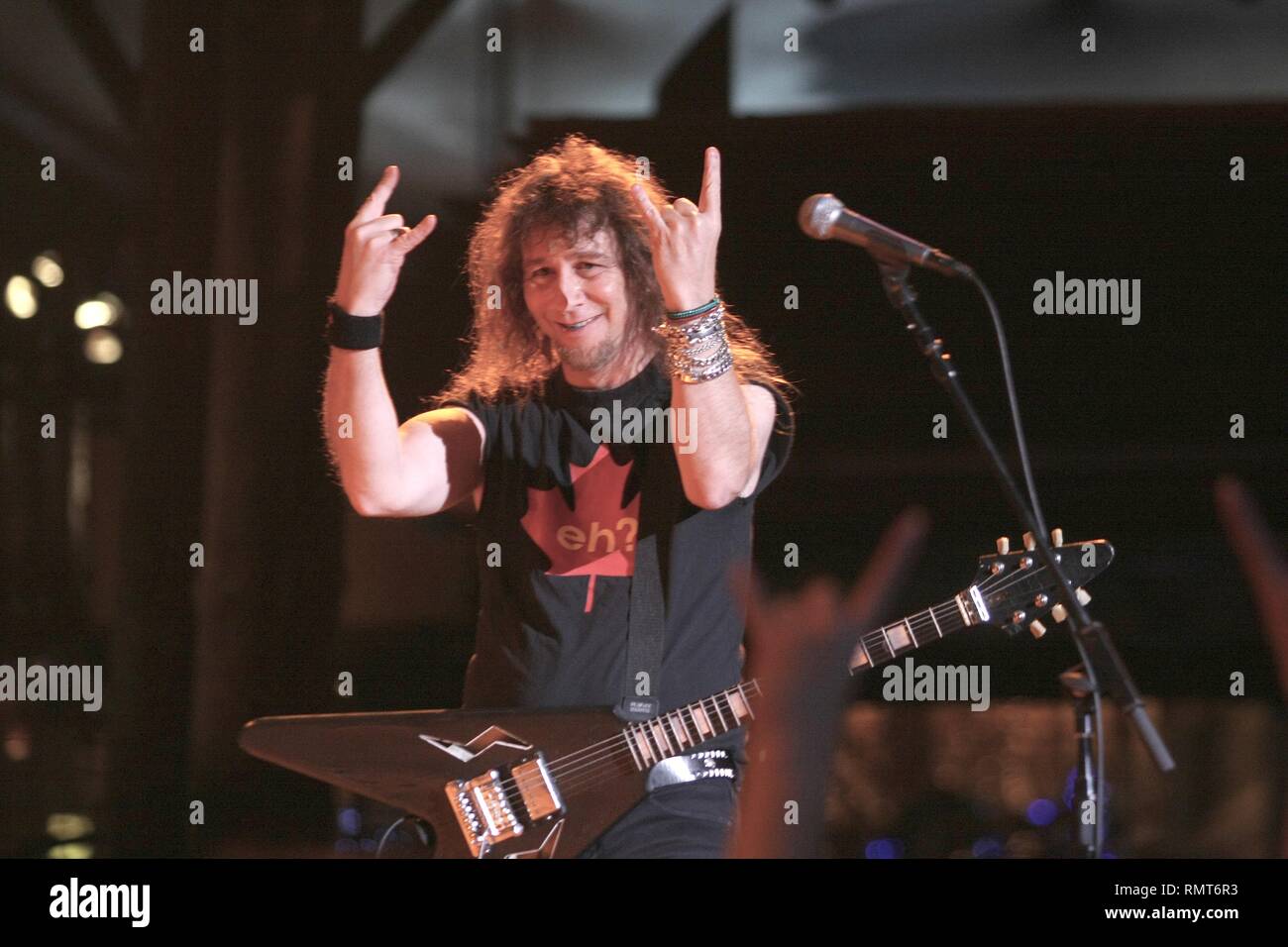 Lead singer and guitarist Steve 'Lips' Kudlow of the Heavy Metal band Anvil is shown performing on stage during a 'live' concert appearance. Stock Photo