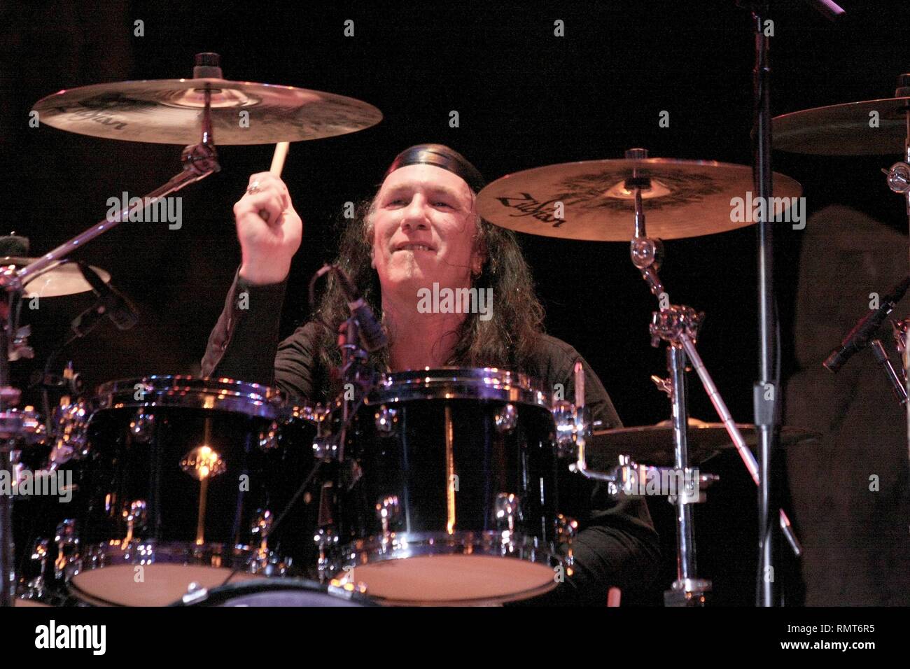 Drummer Robb 'Geza' Reiner of the Heavy Metal band Anvil is shown performing on stage during a 'live' concert appearance. Stock Photo