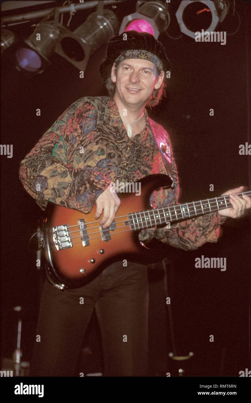 Arc Angels bassist Tommy Shannon is shown having fun on stage during a  concert performance Stock Photo - Alamy