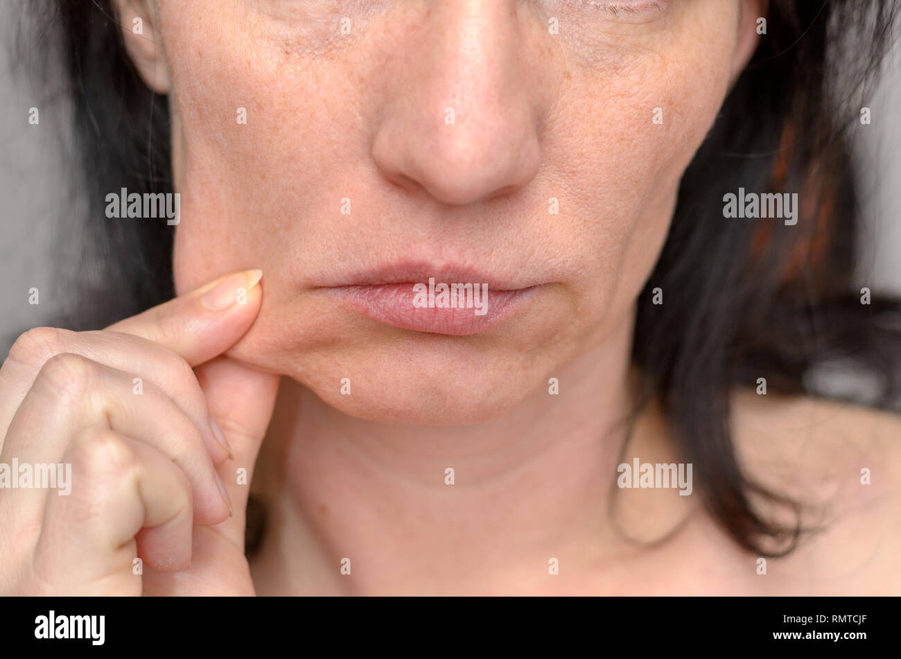 Pinching cheek hires stock photography and images Alamy