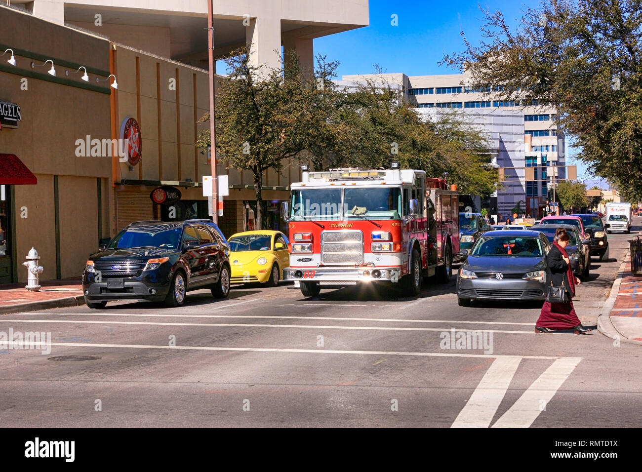 Fire truck in the middle lane of traffic in downtown Tucson Arizona Stock Photo