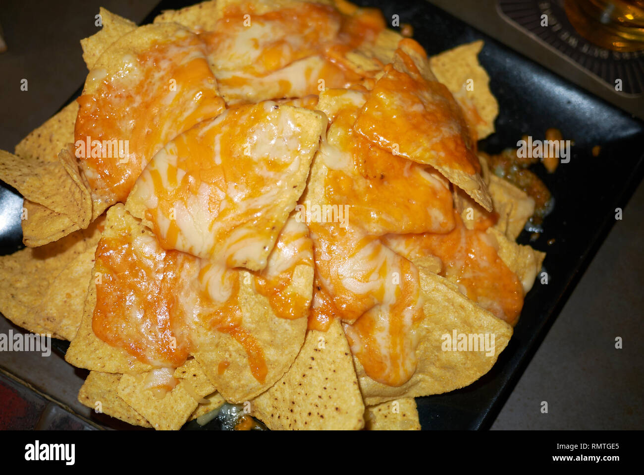 nachos with cheddar cheese Stock Photo Alamy