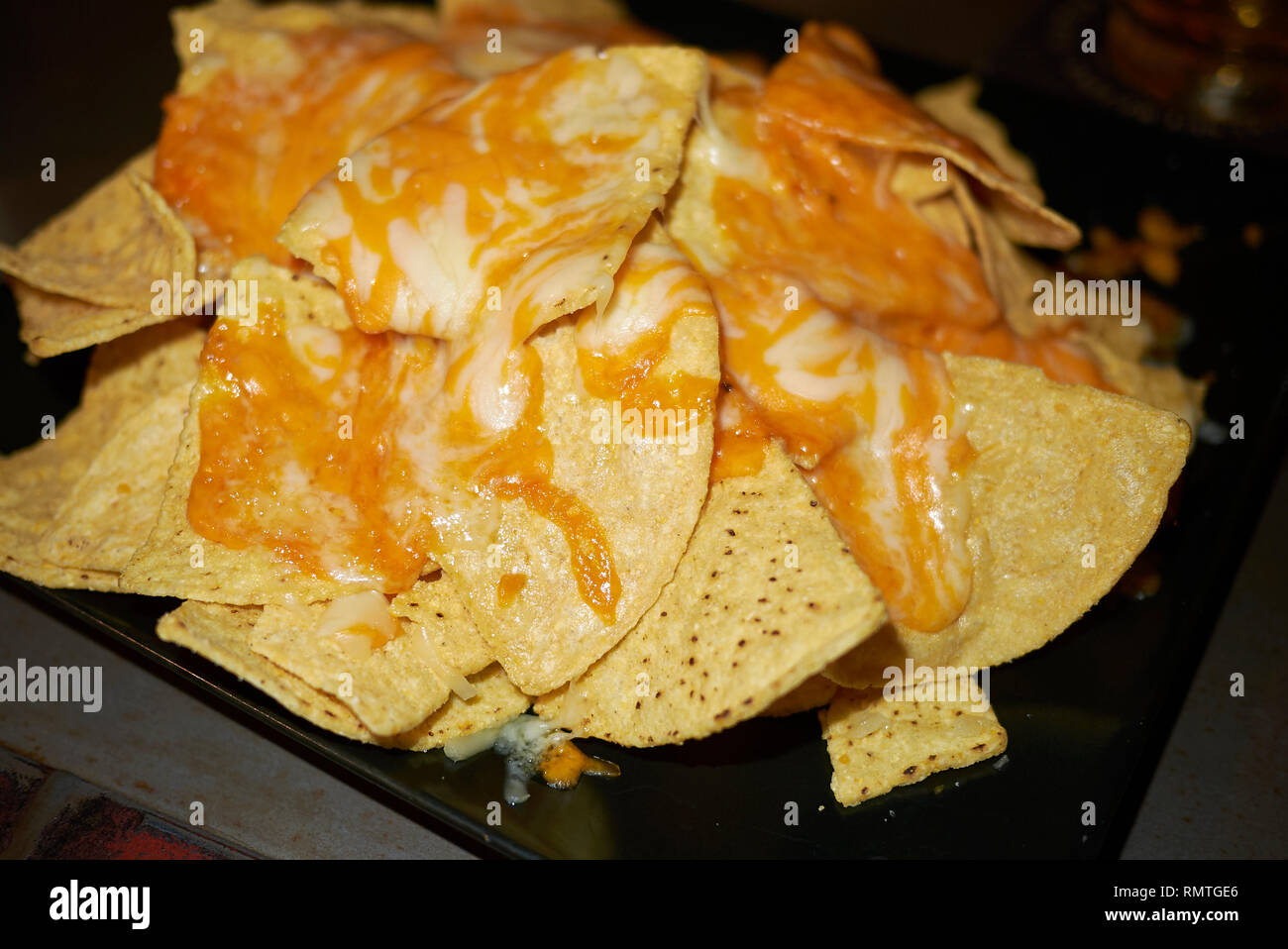 nachos with cheddar cheese Stock Photo Alamy
