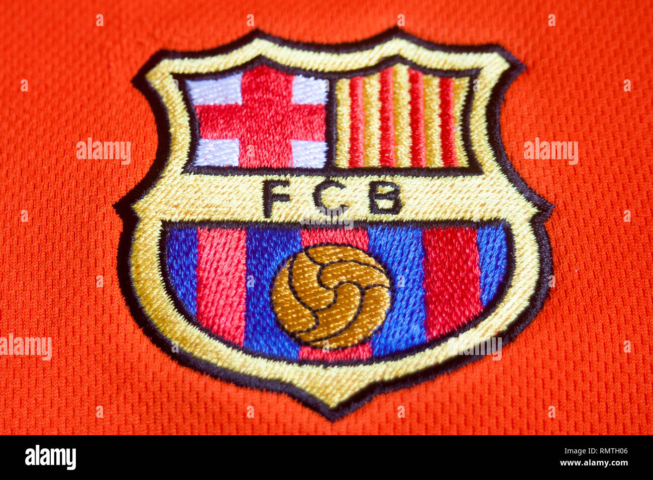 Football Club Barcelona shield on orange shirt Stock Photo