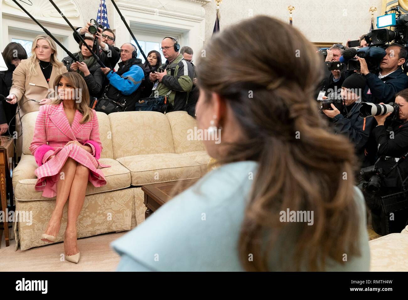 U.S First Lady Melania Trump sits across from Colombian First Lady Maria Juliana Ruiz as their husbands meet in the Oval Office of the White House February 13, 2019 in Washington, DC. Stock Photo