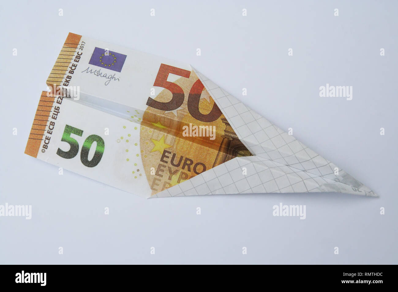 Euro paper bill. Paper aeroplane made of euro bill. Paper plane made of euro currency bill. Stock Photo
