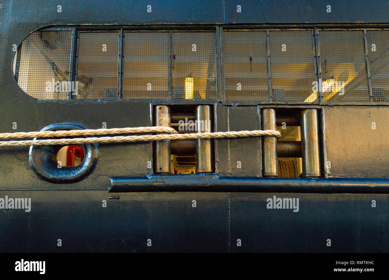 Taut and tied rope mooring lines, fairleads and chock near stern on