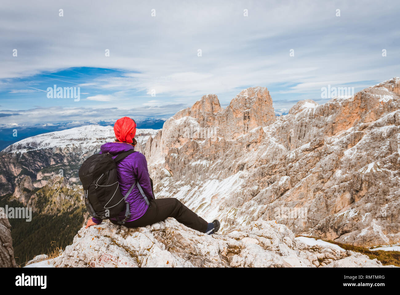 One middle aged woman hiking in mountains, Dolomites Italy Stock Photo