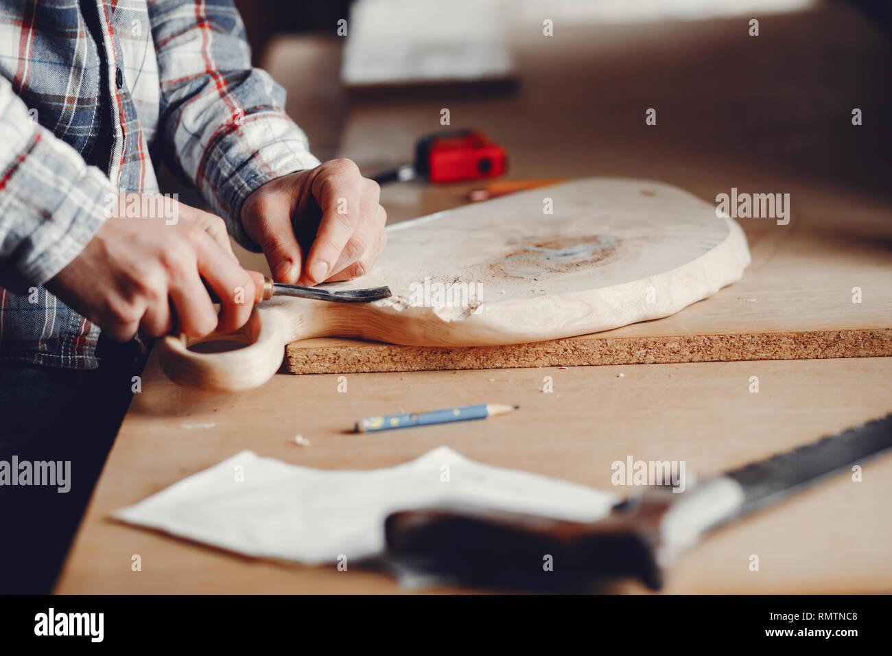 The carpenter works with a tree Stock Photo