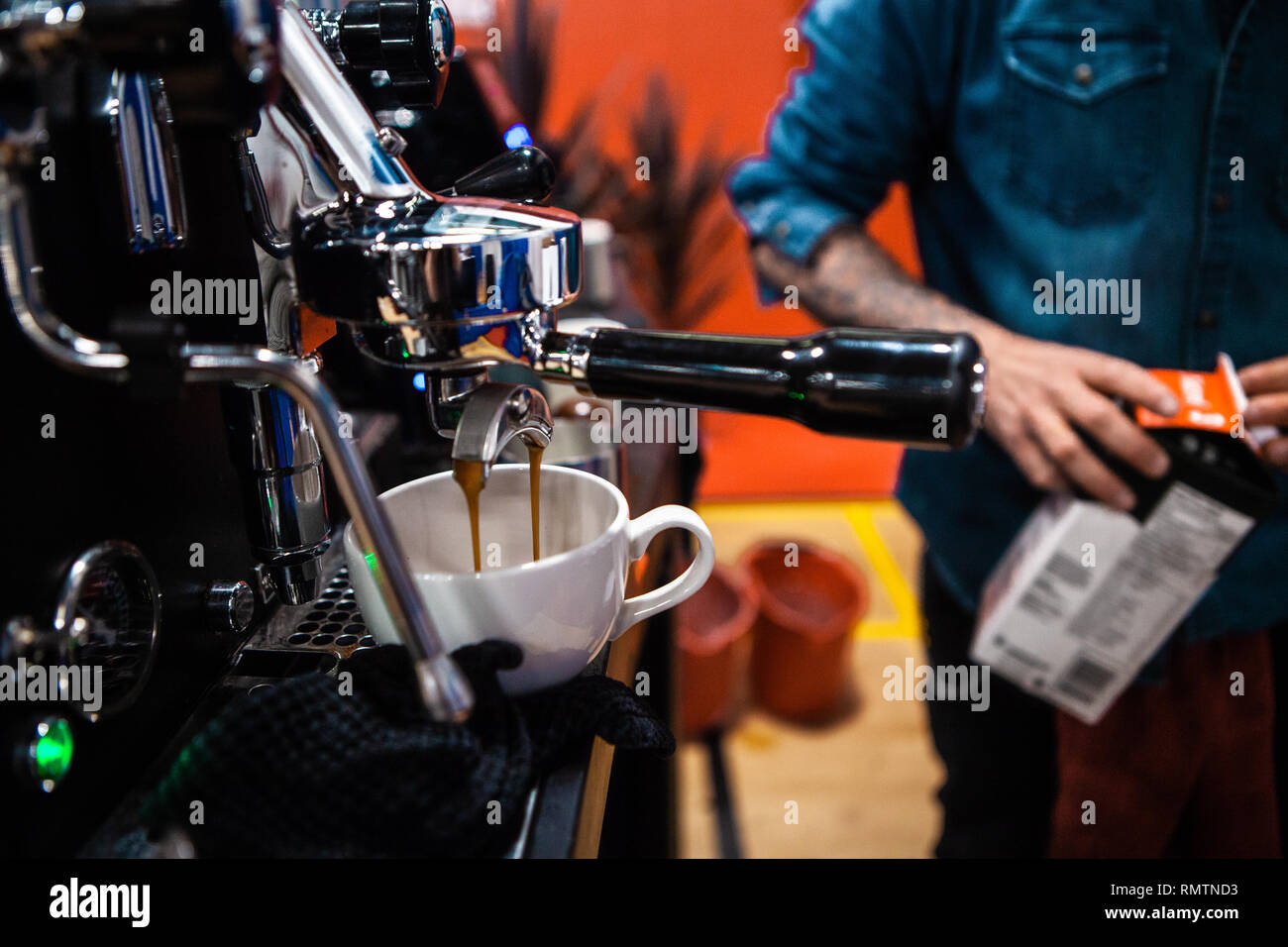 Fancy stainless steel coffee machine pouring a double espresso in a coffee shop Stock Photo Alamy