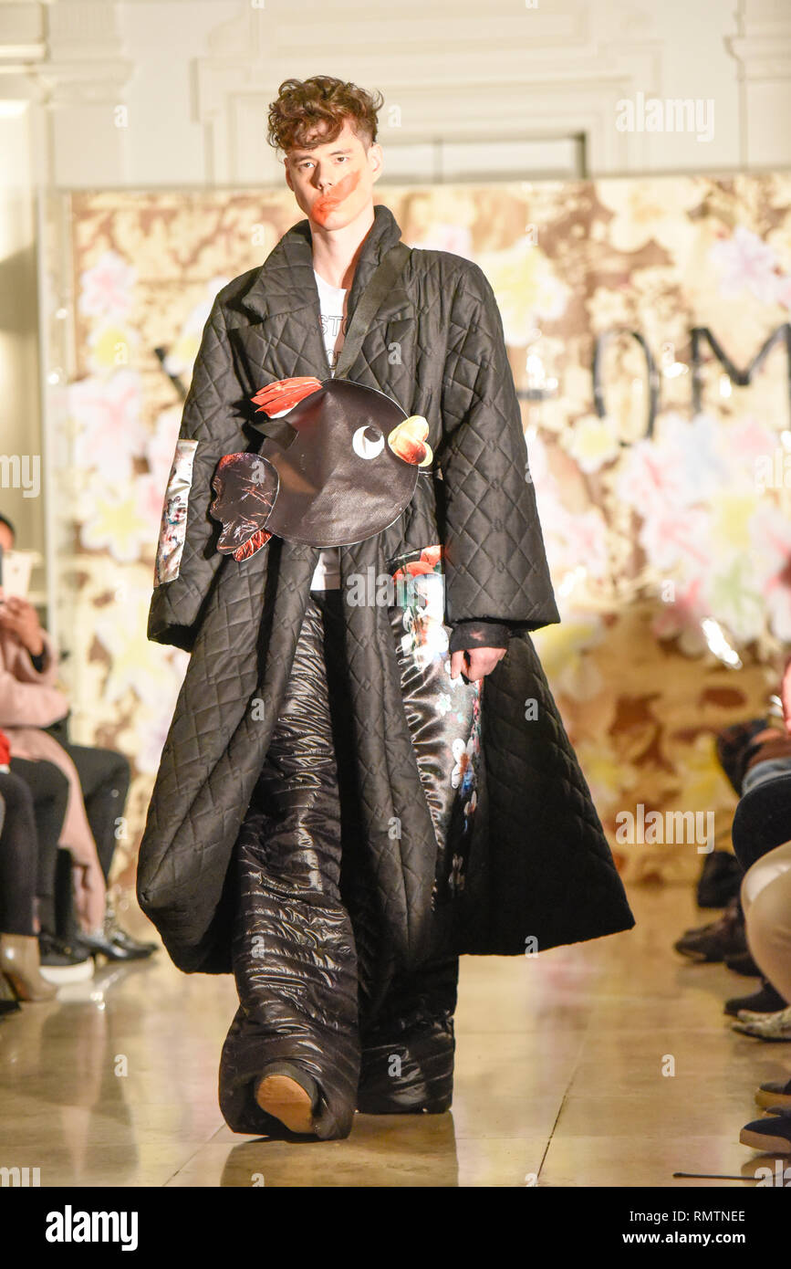 Male model at Vin + Omi catwalk show to launch London Fashion Week in Andaz London, UK. Outlandish outfit Stock Photo