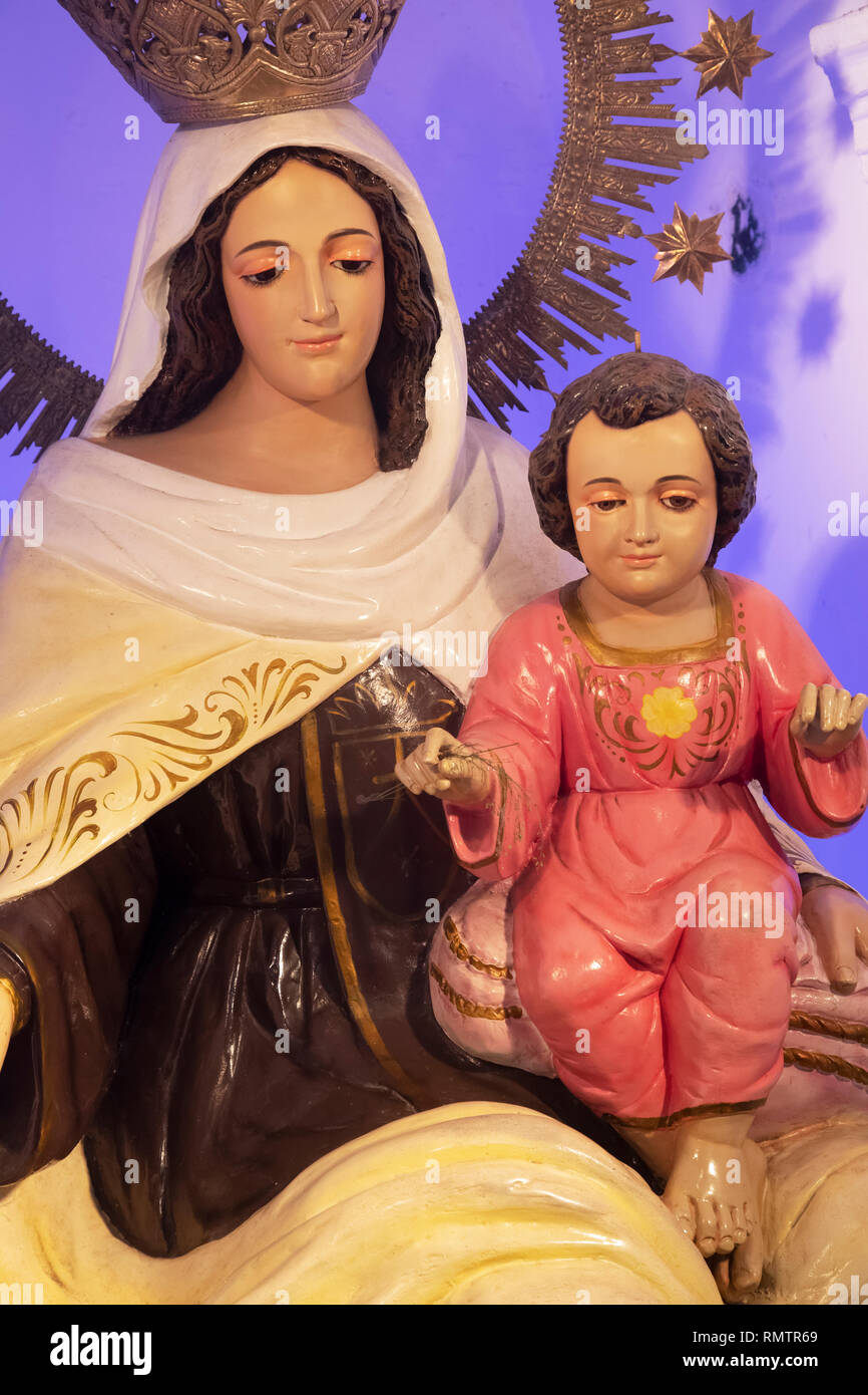 Statue of the Virgin Mary and baby Jesus inside the Church of Barasain, built in 1859 and destroyed by fire in 1884.  Rebuilt in 1885. It is one of th Stock Photo