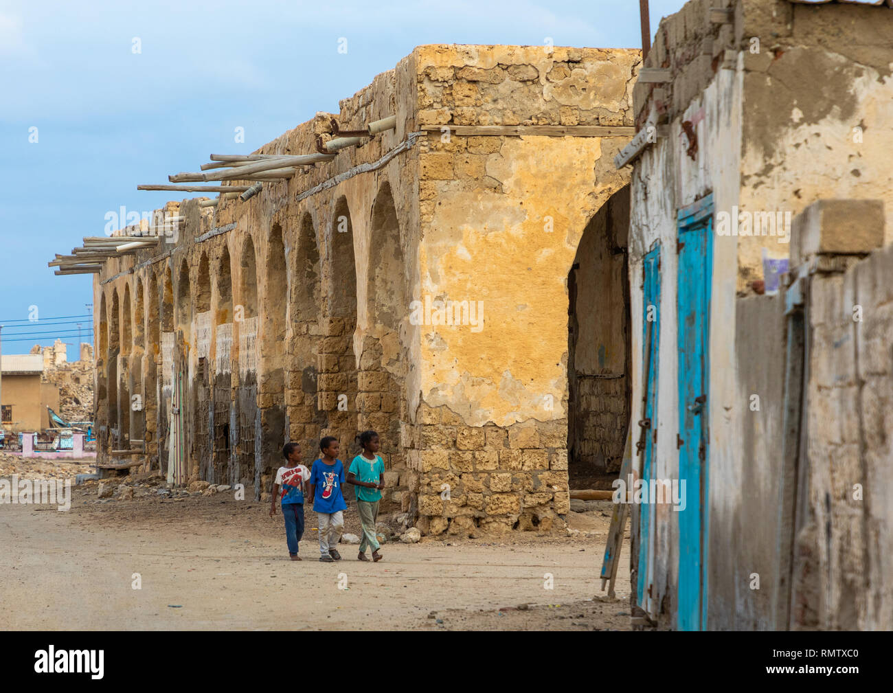 Sudanese Children In Front Of An Old Building On Mainland, Red Sea 