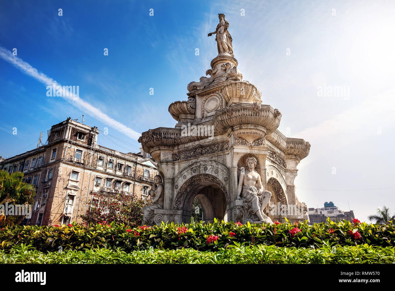 Flora Fountain and Oriental Old Building at blue sky in sunny at fort area in Mumbai, Maharashtra, India Stock Photo