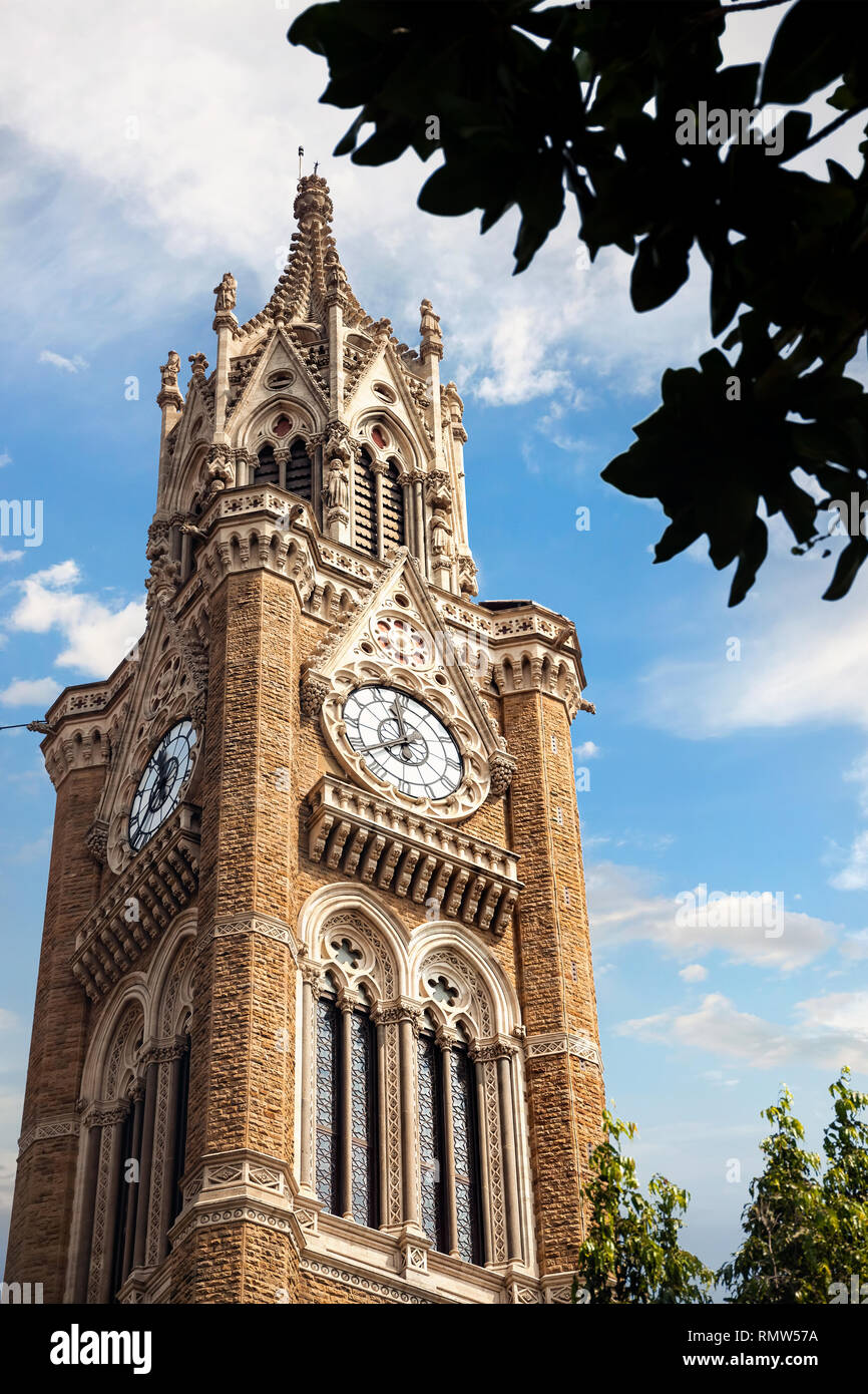 Rajabai Clock Tower at blue cloudy sky background in Mumbai, India Stock Photo