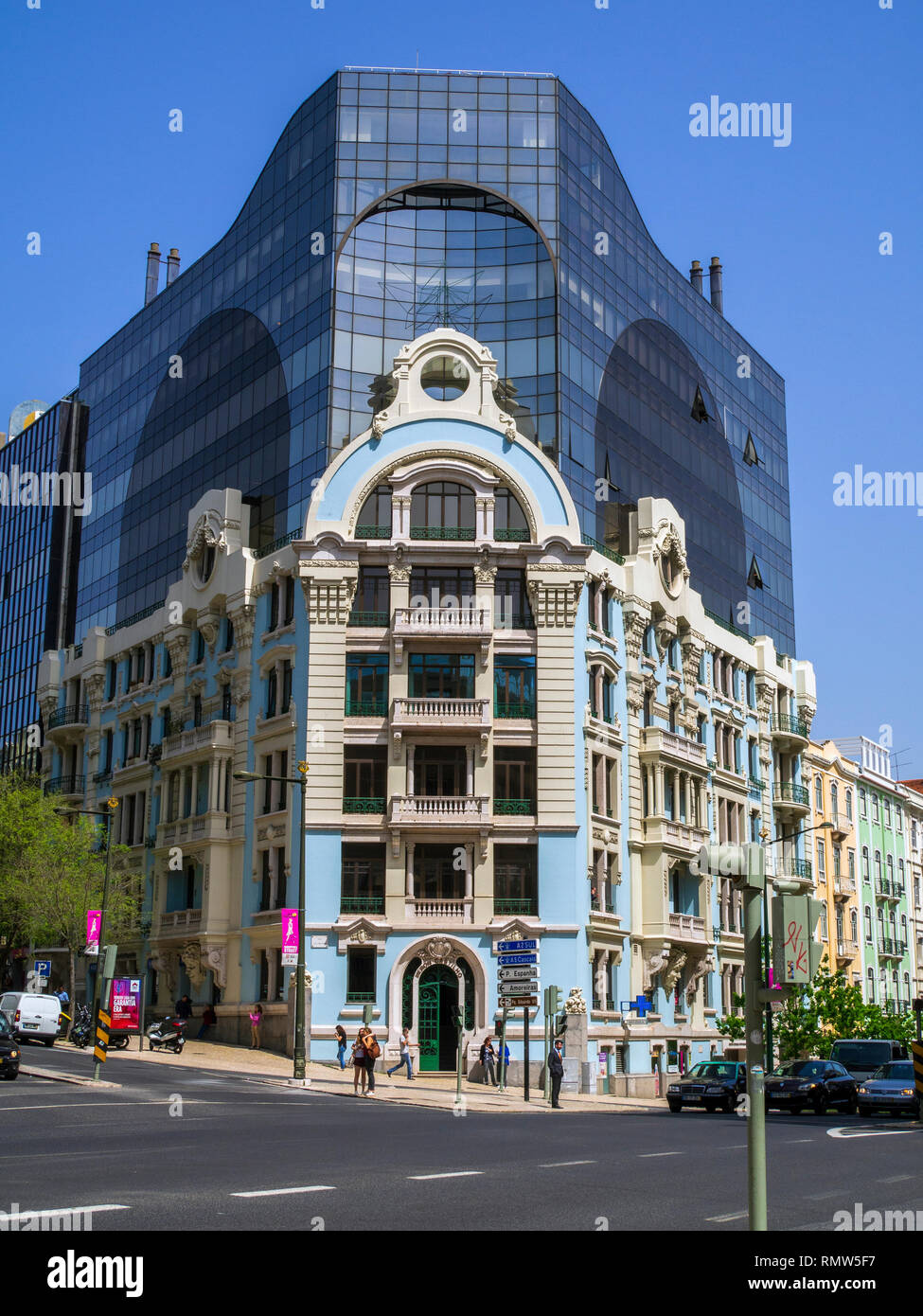 A modern office building using the facade of a 19th century apartment building in the central business district of Lisbon, Portugal. Stock Photo