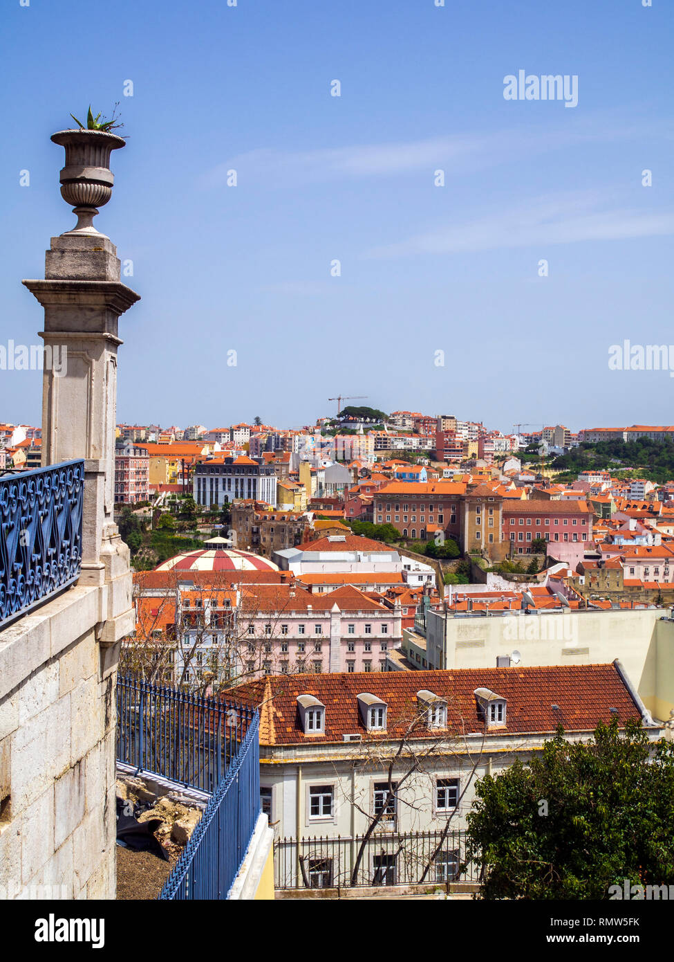The view over Lisbon as seen from the Miradouro de Sao Pedro de Alcantara, a landscaped terrace with a fountain offers panoramic views of the city. Stock Photo
