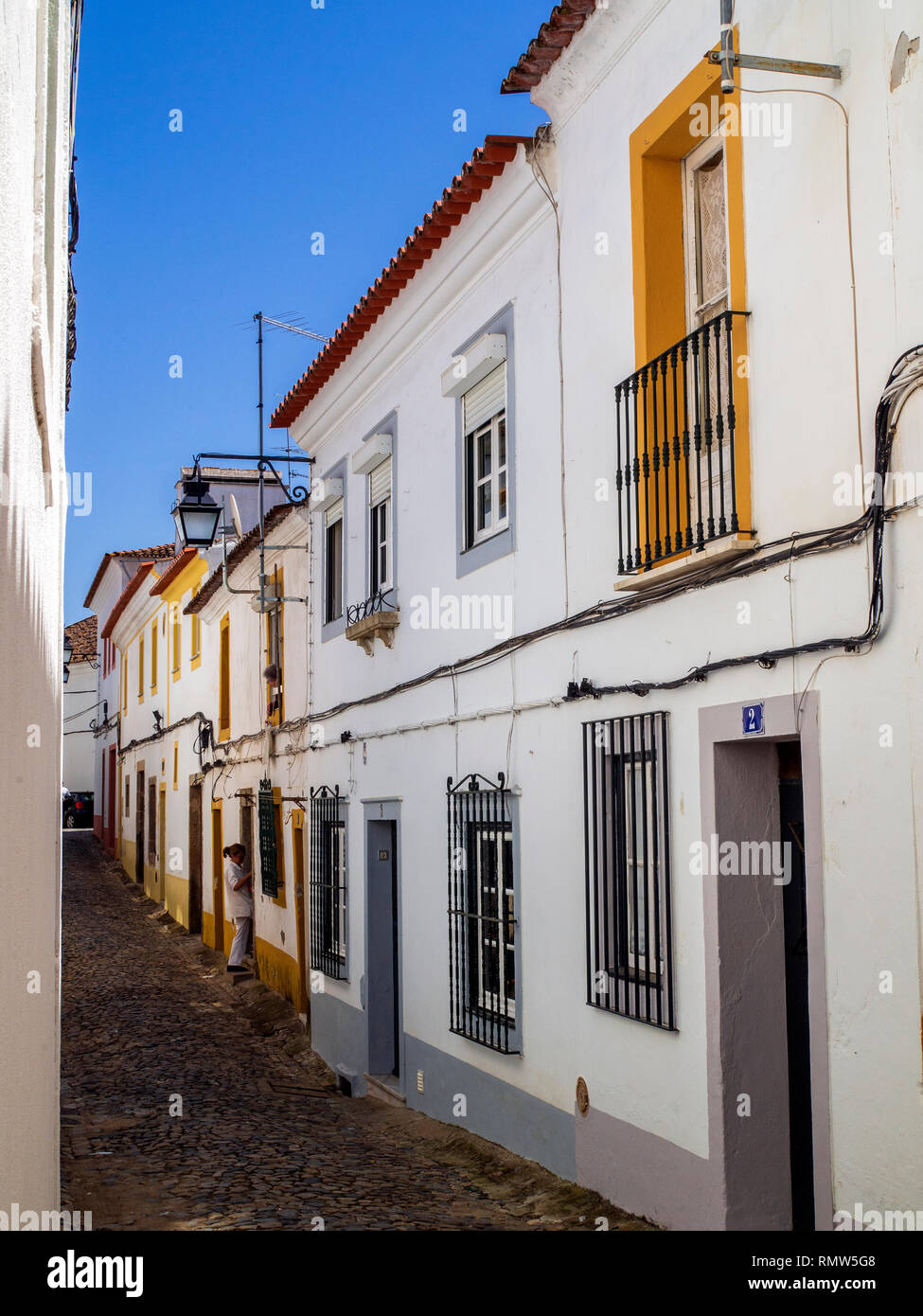 Yellow and white box houses in Evora, Alentejo Province, Portugal. Stock Photo