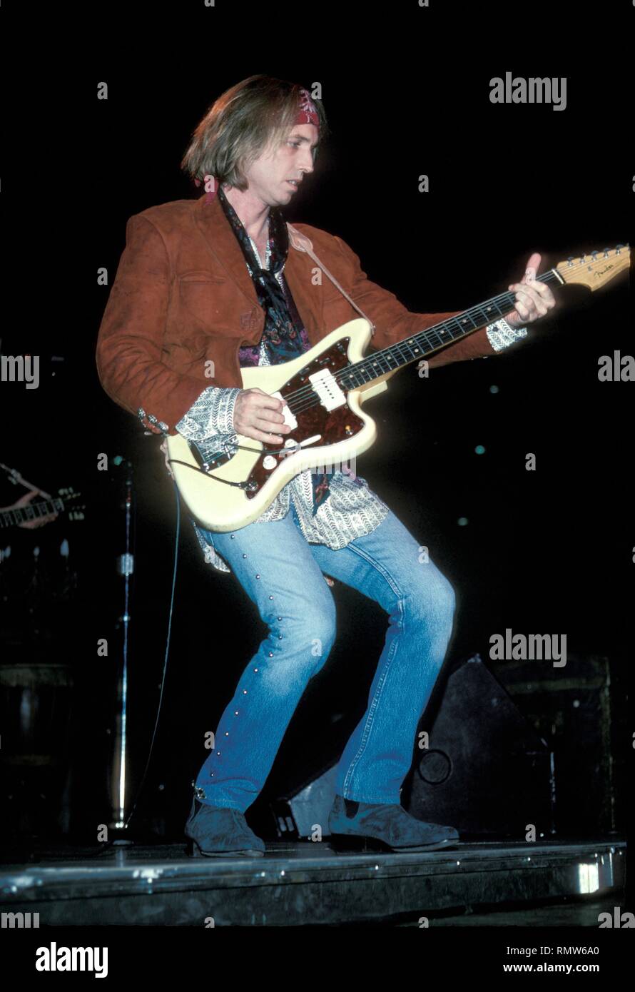 Singer, songwriter and multi-instrumentalist Tom Petty is shown performing on stage during a 'live' concert appearance. Stock Photo