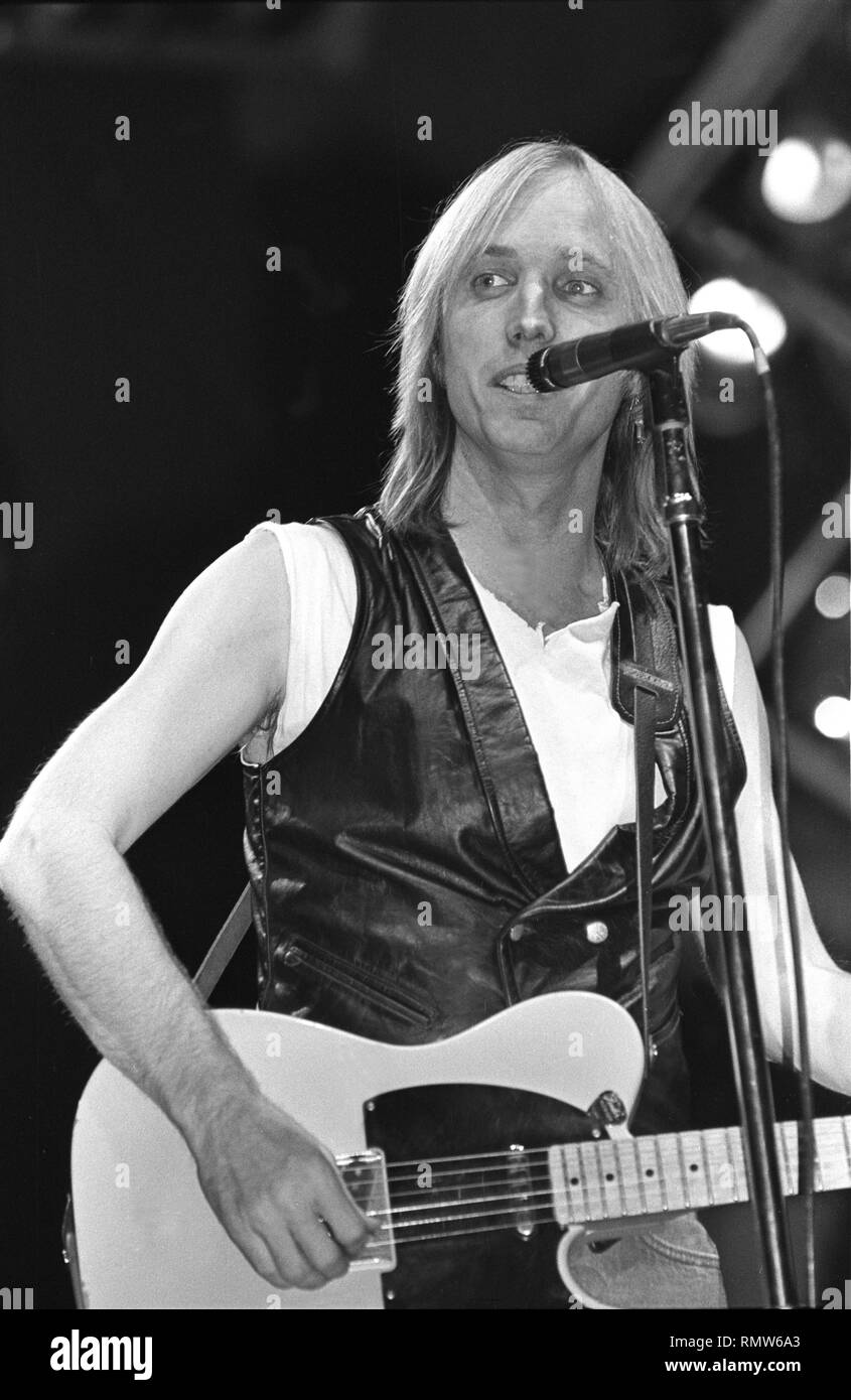 Singer, songwriter and multi-instrumentalist Tom Petty is shown performing on stage during a 'live' concert appearance. Stock Photo