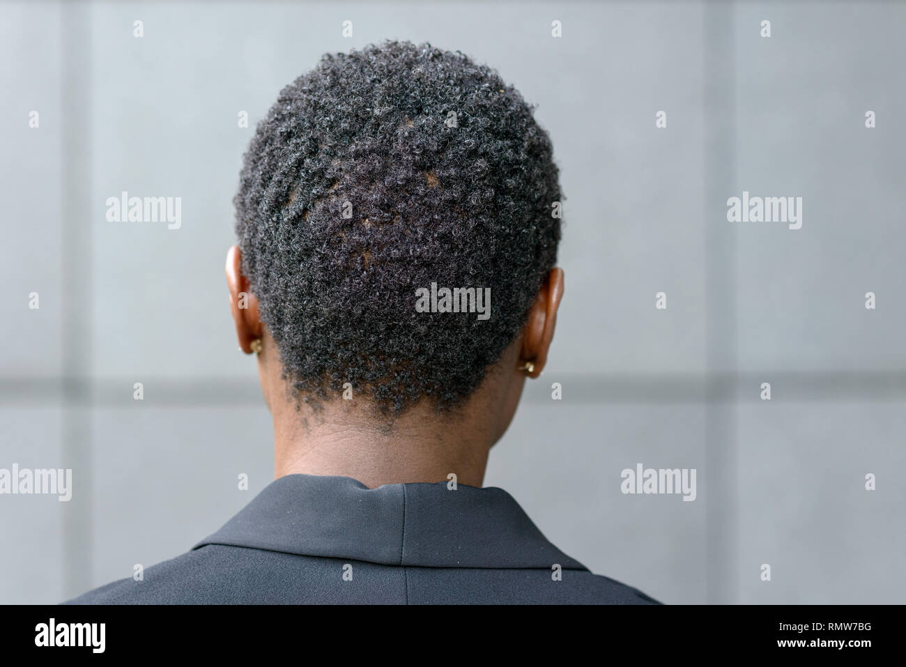 Close Up Backview Portrait Of Young Black Woman With Short Haircut