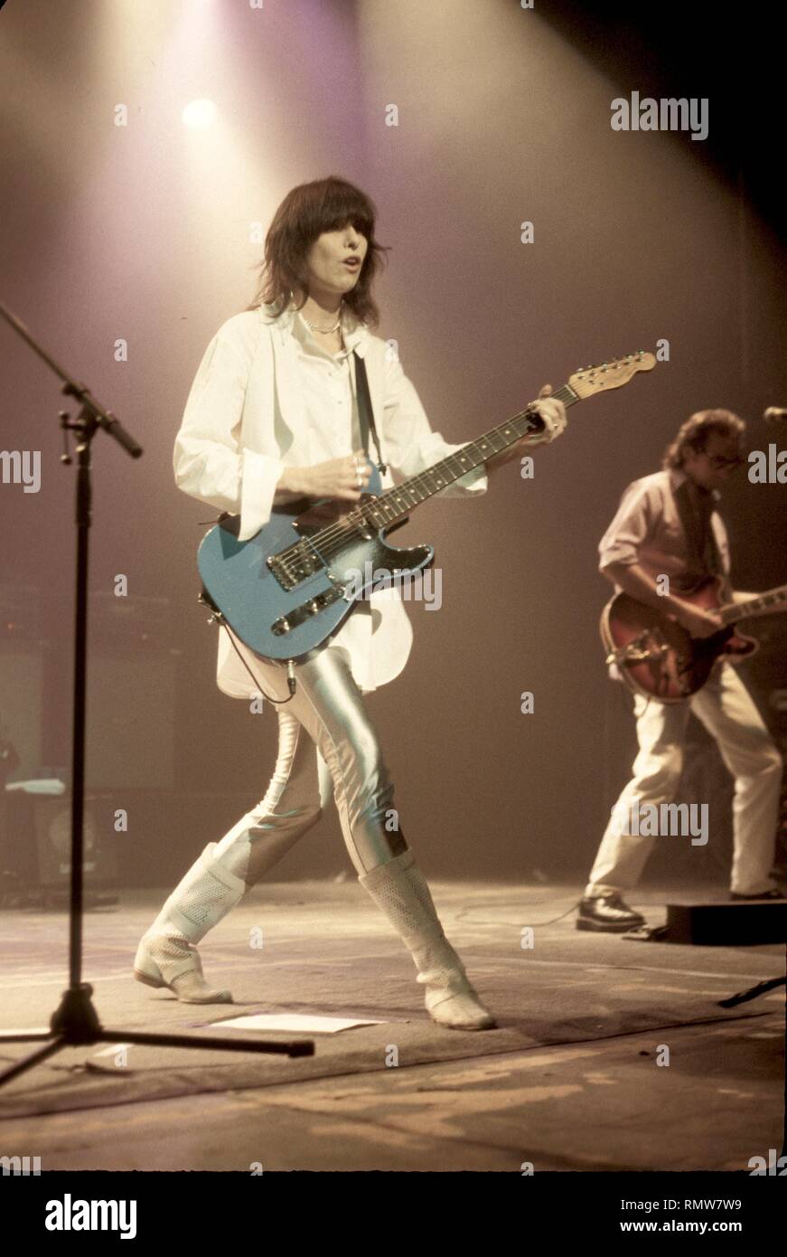 SInger, songwriter & guitarist Chrissie Hynde of British rock band The Pretenders is shown performing on stage during a 'live' concert appearance. Stock Photo