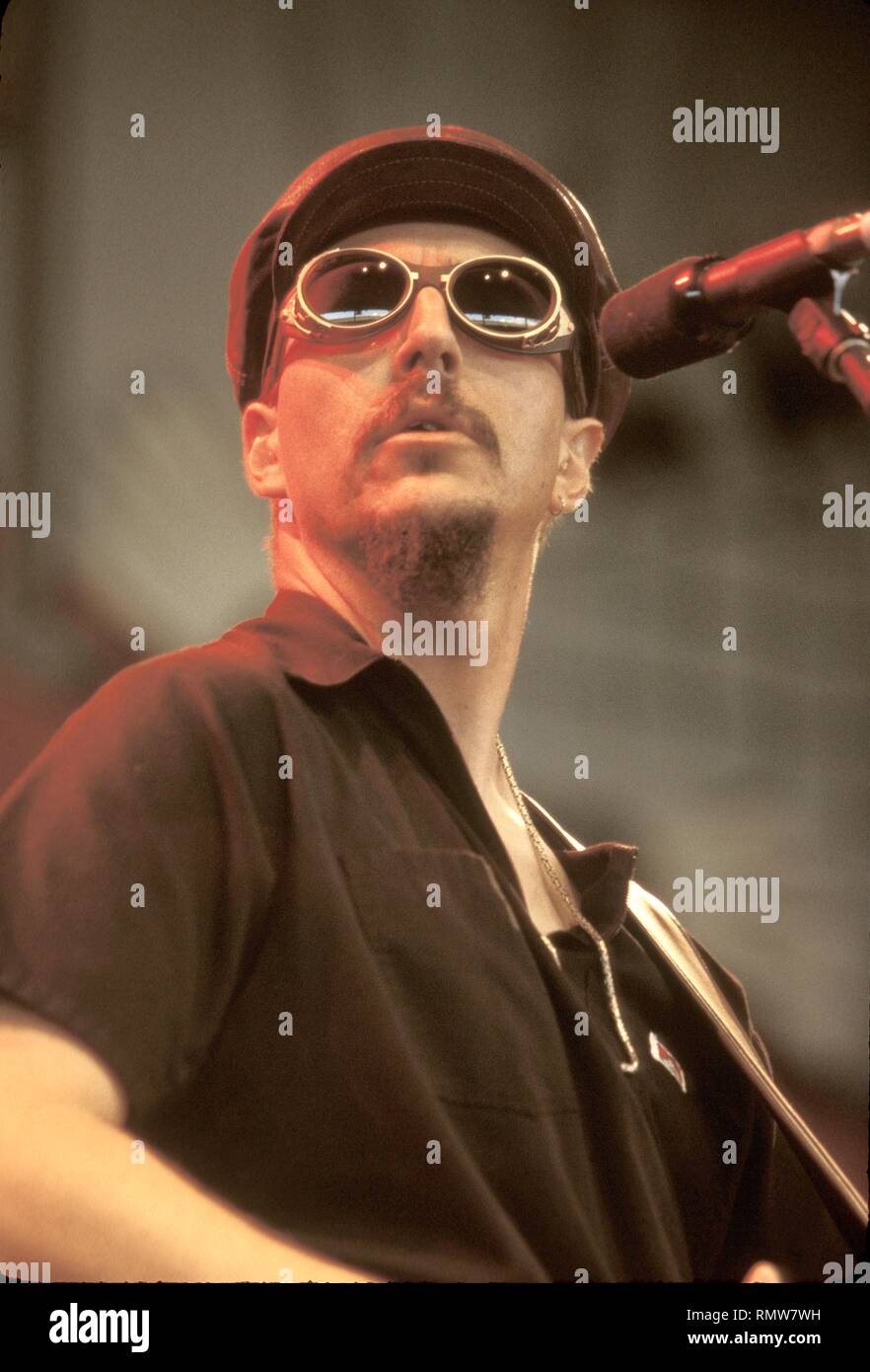 Singer and bassist Les Claypool of the rock band Primus is shown performing on stage during a