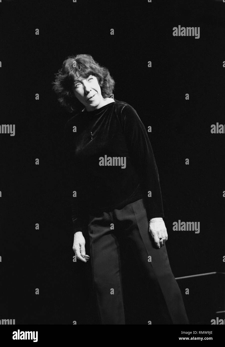 Actress, comedian, writer, and producer Lily Tomlin is shown performing on stage during a 'live' stand up comedy show. Stock Photo