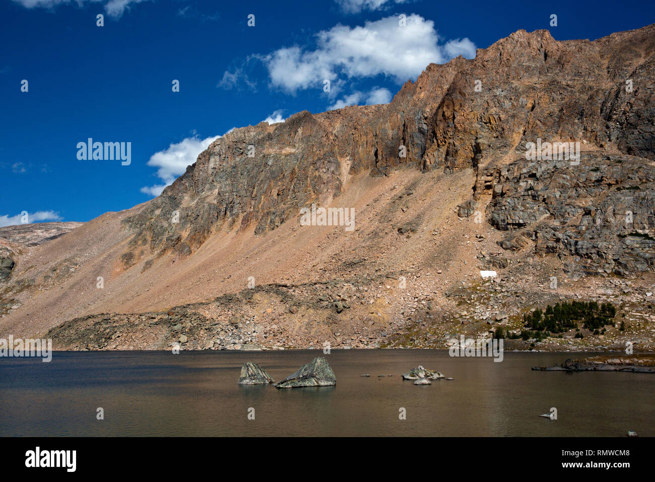 WYOMING - Rock islands in an unnamed lake along the Beartooth Highlakes Trail in the Beartooth Mountains area of the Shoshone National Forest. Stock Photo