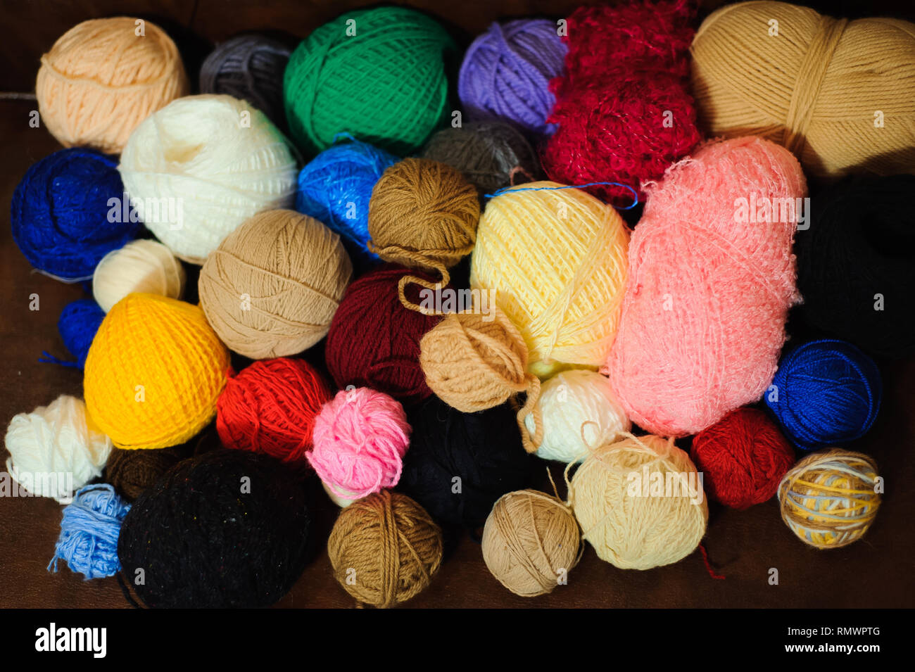 Colored balls of yarn. View from above. Rainbow colors. All colors. Yarn  for knitting. Skeins of yarn. Stock Photo