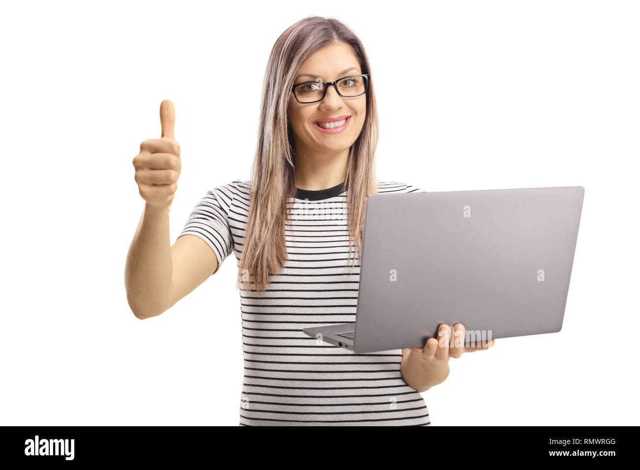 Young blond woman holding a laptop computer and showing thumbs up ...