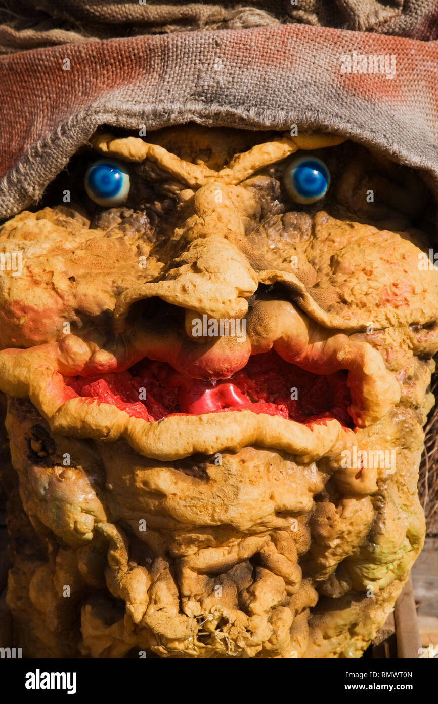 Close-up of a yellow foam Halloween monster face. Stock Photo