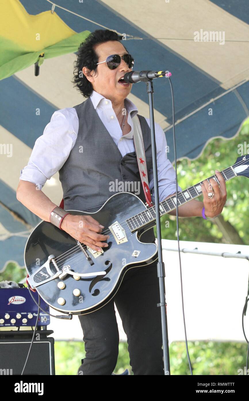 Singer, songwriter and guitarist Alejandro Escovedo is shown performing on stage during a 'live' concert appearance. Stock Photo