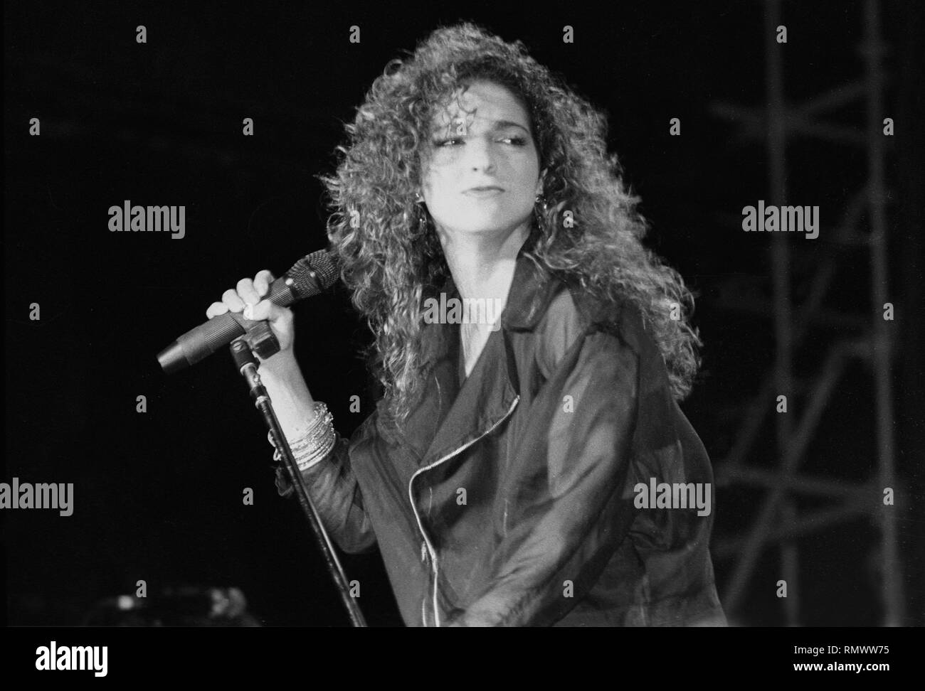 Singer and songwriter Gloria Estefan is shown performing on stage during a 'live' concert appearance. Stock Photo