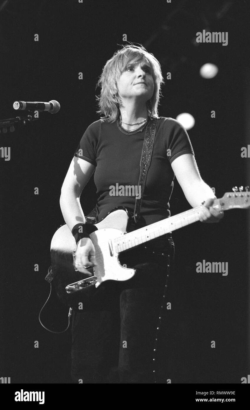 Musician Melissa Etheridge is shown performing on stage during a "live