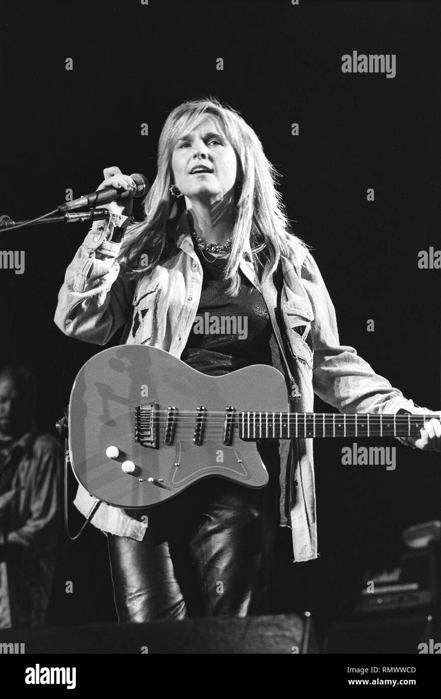 Musician Melissa Etheridge is shown performing on stage during a "live