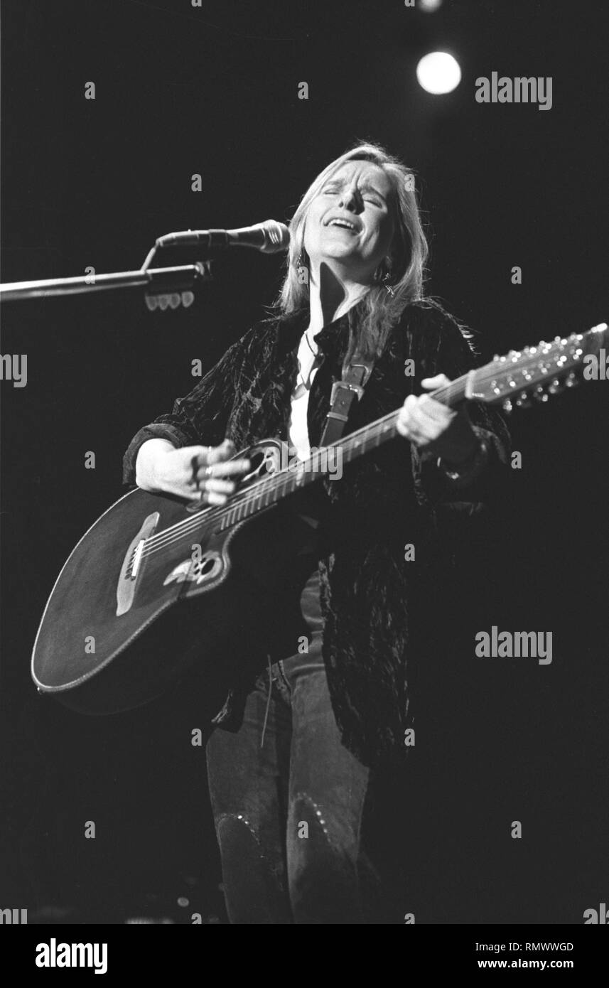 Musician Melissa Etheridge is shown performing on stage during a "live