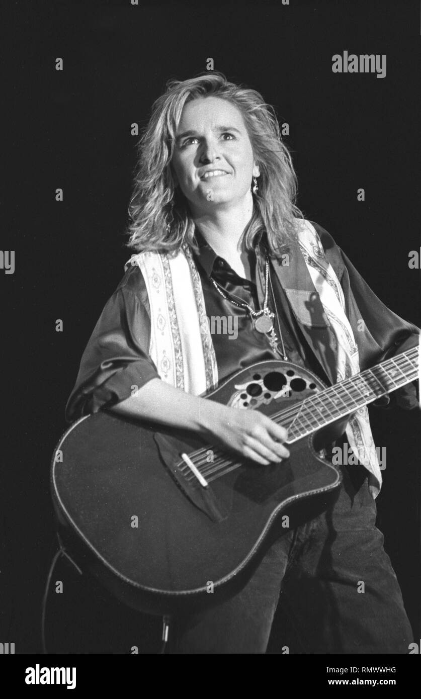 Musician Melissa Etheridge is shown performing on stage during a "live