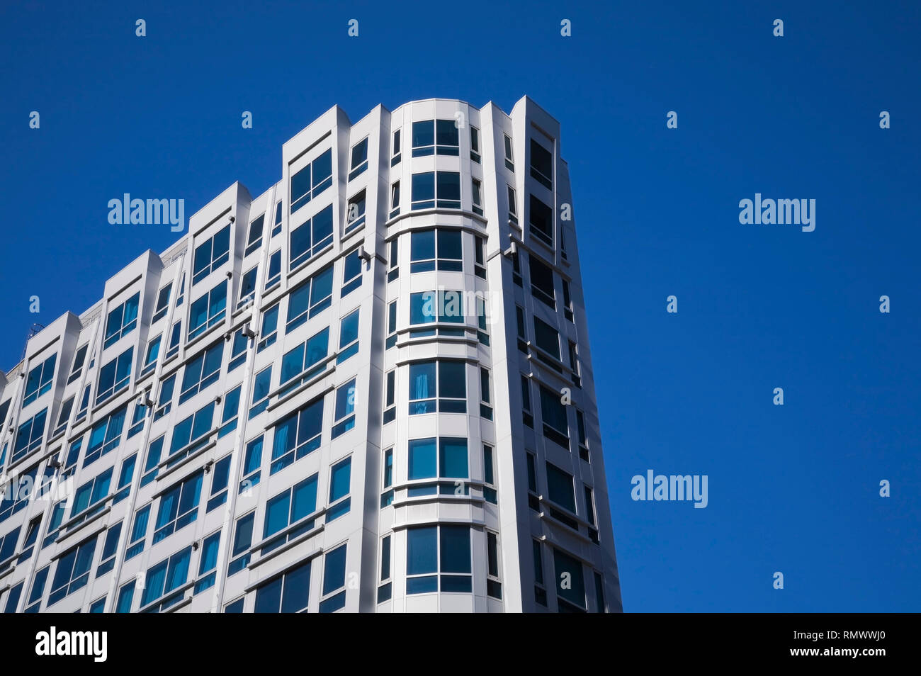 Modern architectural building against a blue sky background Stock Photo ...