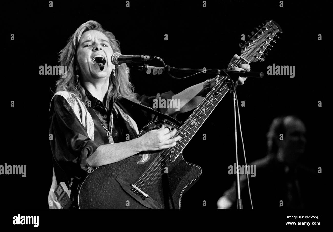 Musician Melissa Etheridge is shown performing on stage during a "live