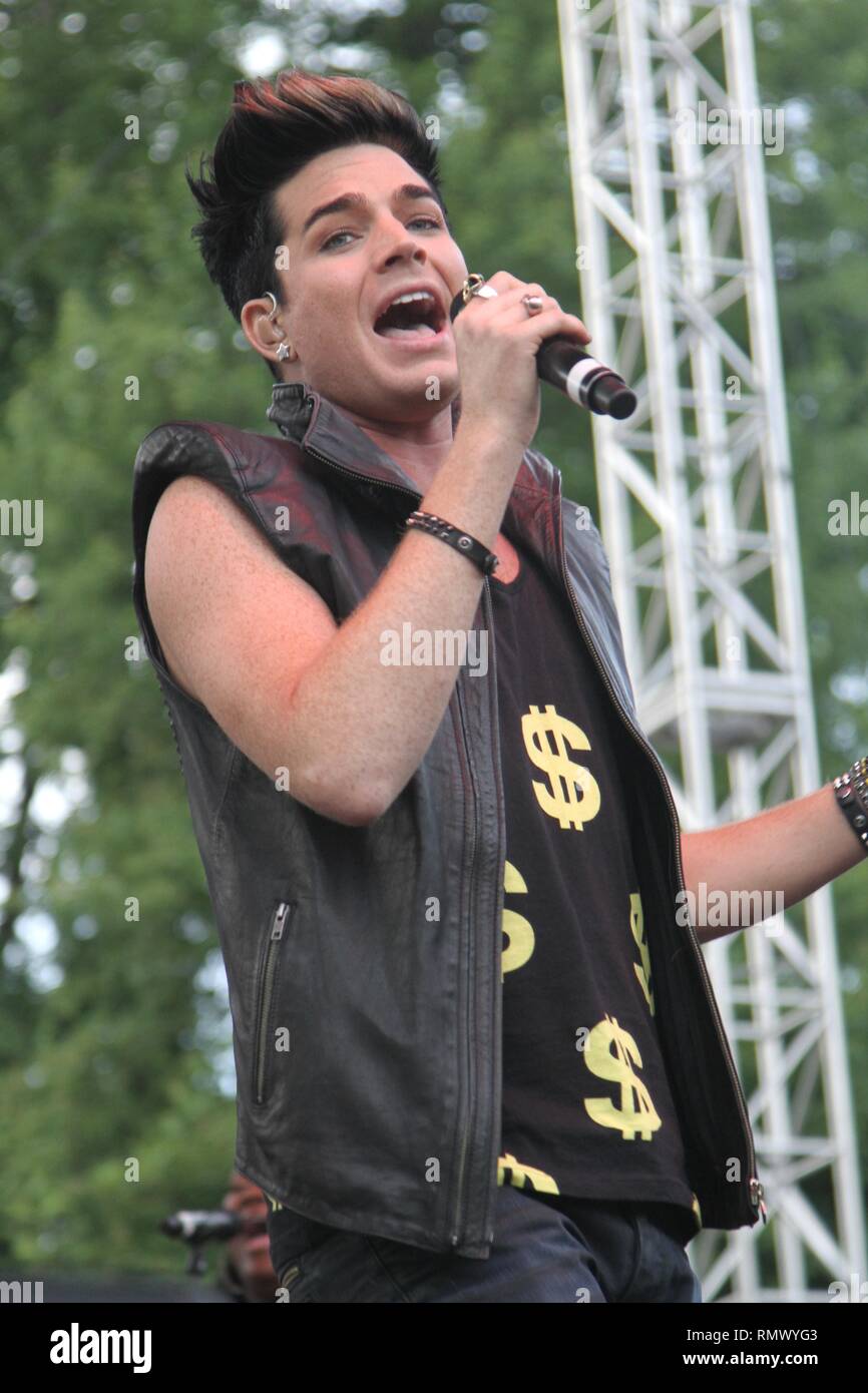 Singer, songwriter and actor Adam Lambert is shown performing on stage during a 'live' concert  appearance. Stock Photo