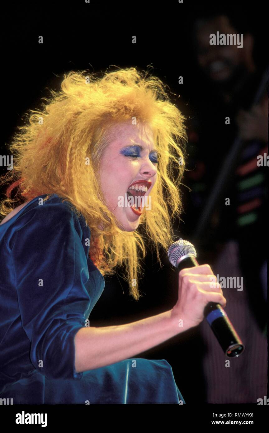 Grammy and Emmy award winning singer, songwriter and actress Cyndi Lauper is shown performing on stage during a 'live' concert appearance. Stock Photo