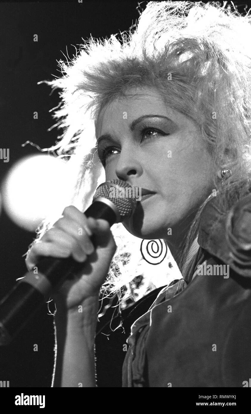Singer Cyndi Lauper is shown performing on stage during a 'live' concert appearance. Stock Photo