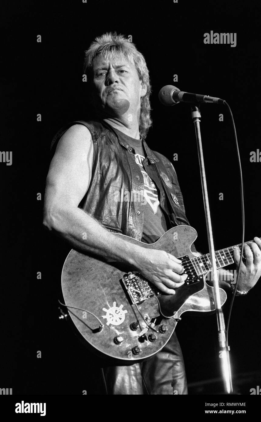 English rock guitarist and singer Alvin Lee is shown performing on stage during a 'live' concert appearance. Stock Photo
