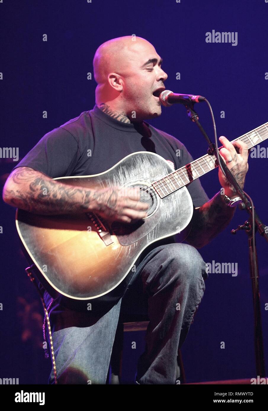 Musician Aaron Lewis is shown performing solo and acoustic during a